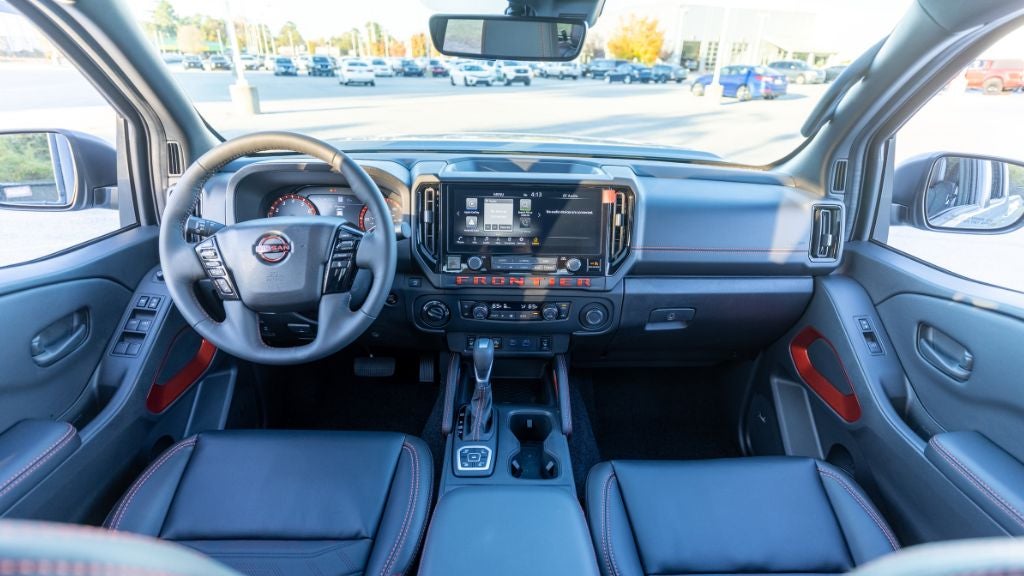 2026 Nissan Frontier interior, including the infotainment system and steering wheel