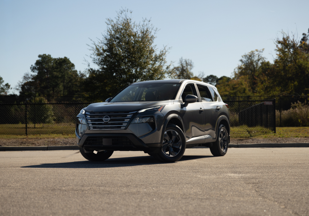 Gray 2026 Nissan Rogue parked with trees in the background