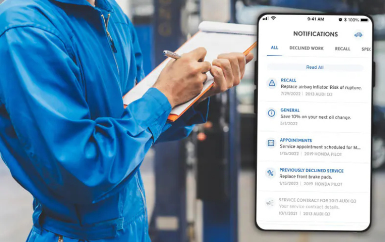 Somone writing on a clipboard next to an image of a phone the the Flow Garage mobile app pulled up