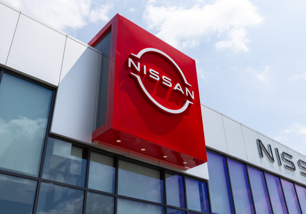 Nissan logo signage on the front of the Flow Nissan of Statesville dealership
