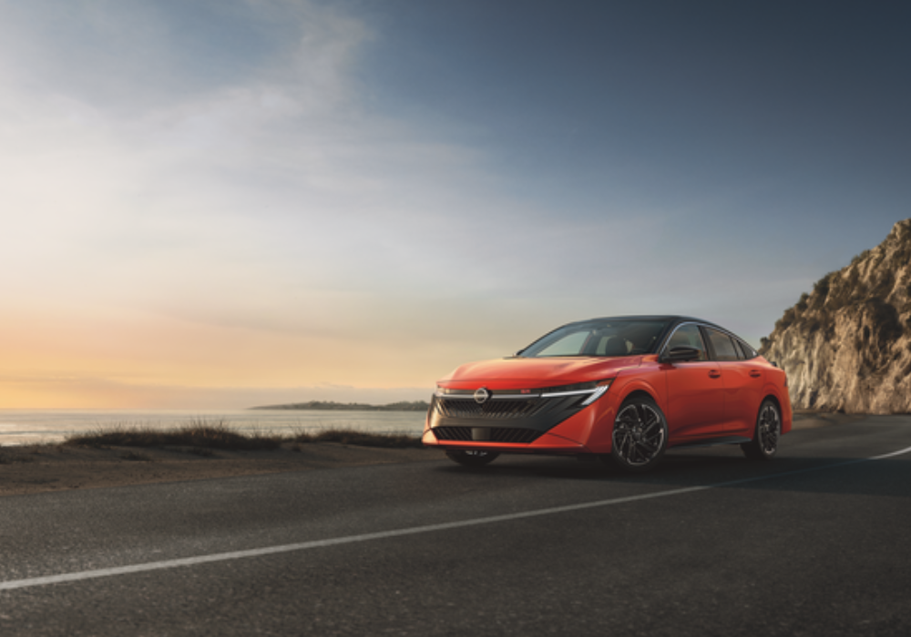2026 nissan sentra driving down a coast