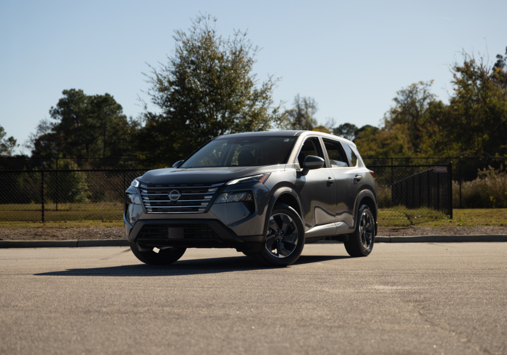 2026 Nissan Rogue parked on a paved surface with trees in the background